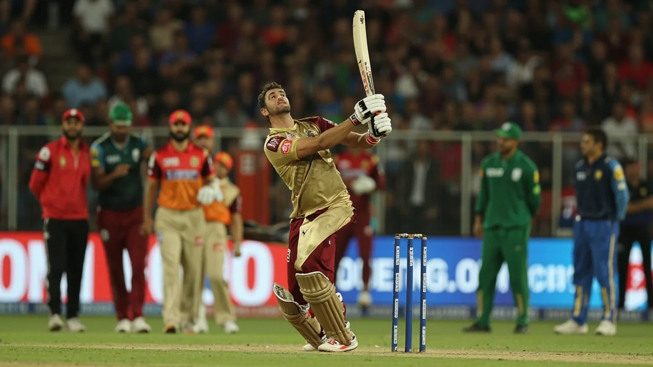 Medium tactical view of an IPL match showing field placement and players between overs at Dharamsala